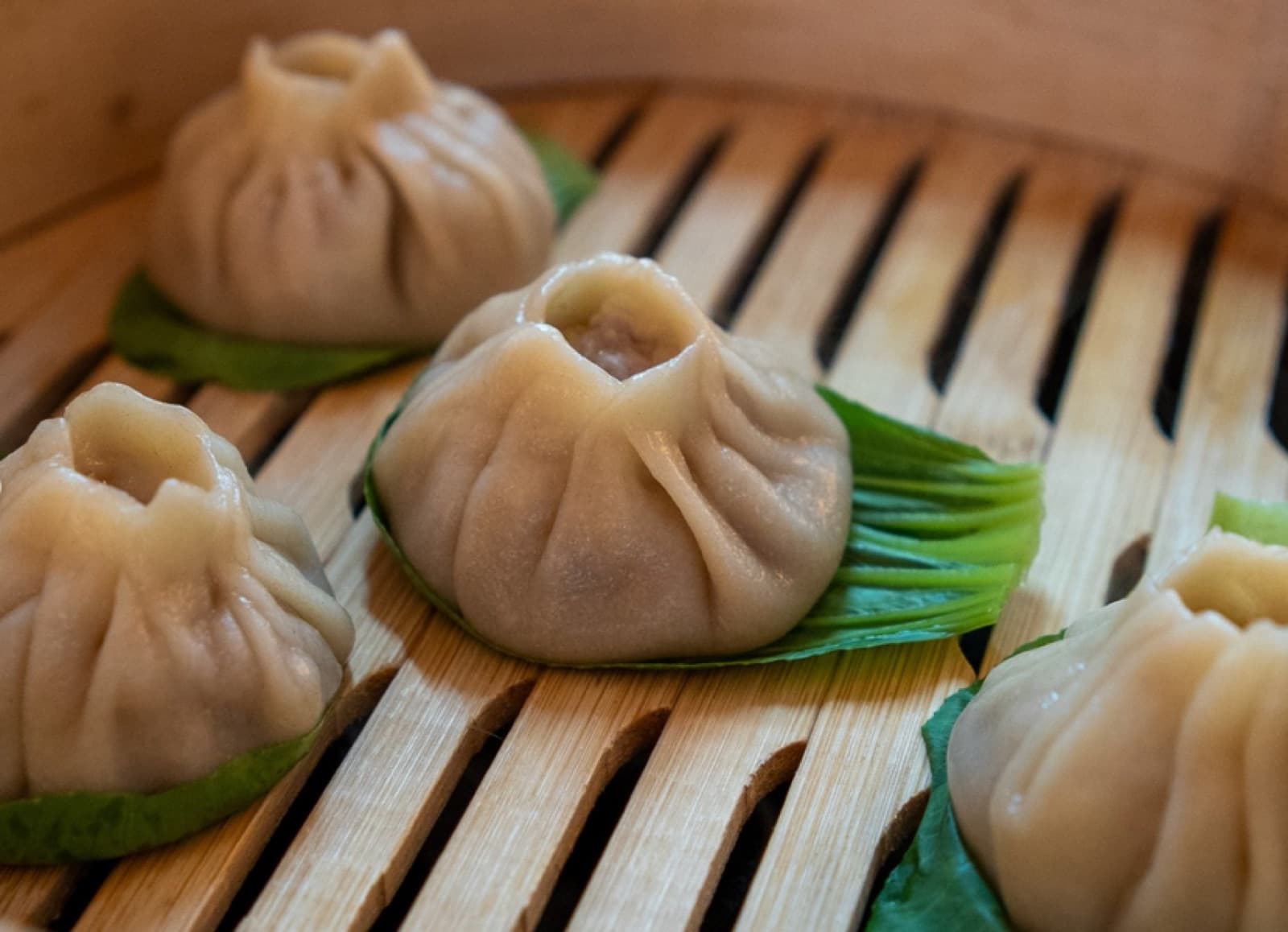 Soup dumplings in a bamboo steamer